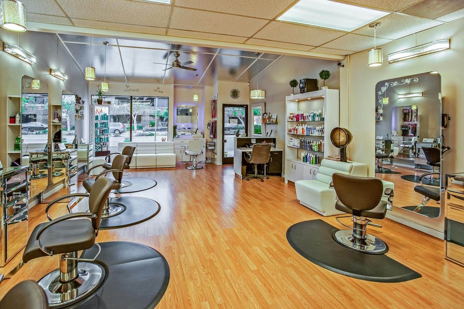 A beautiful salon with brown chairs and beauty accessories