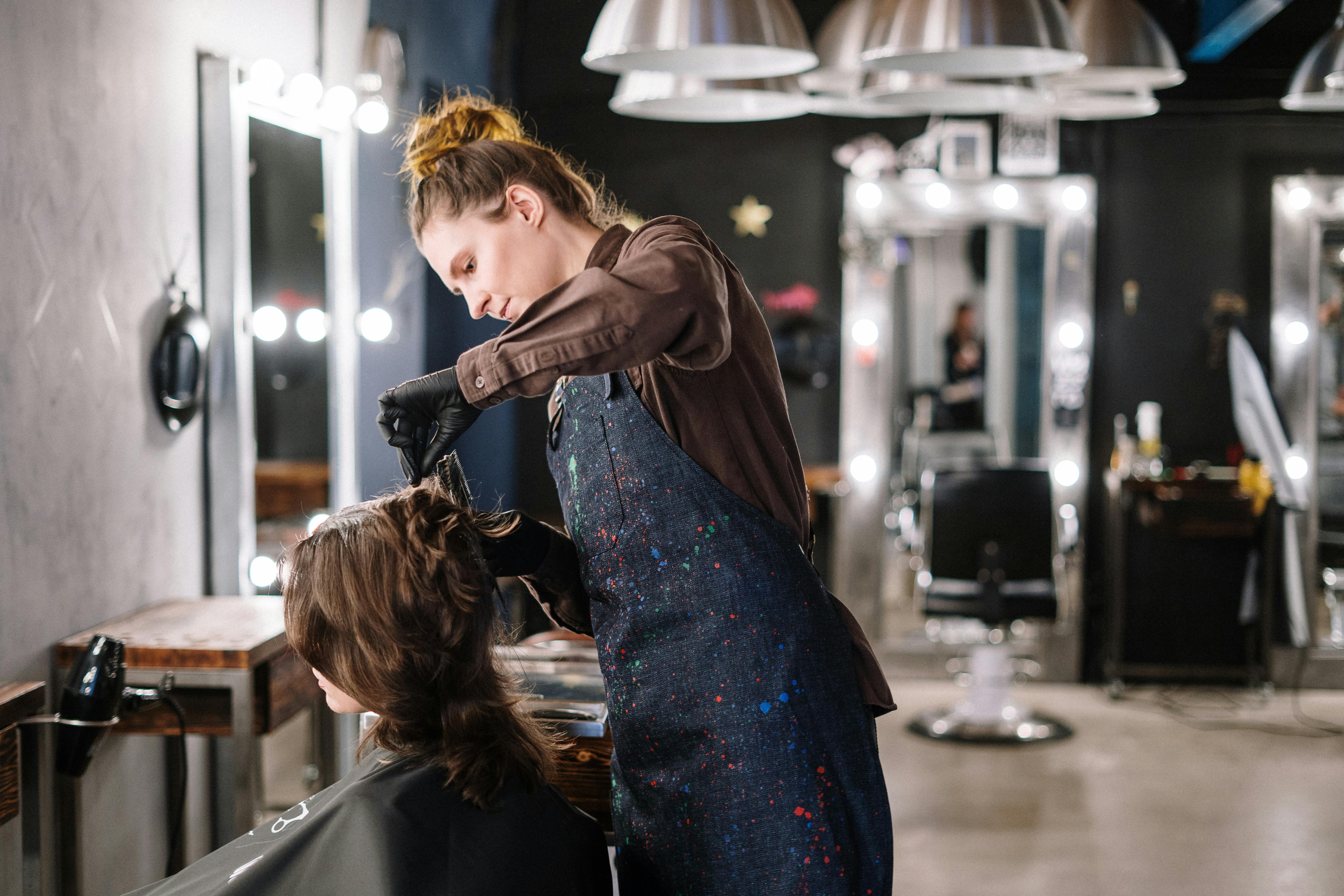 A woman gets a haircut in a salon