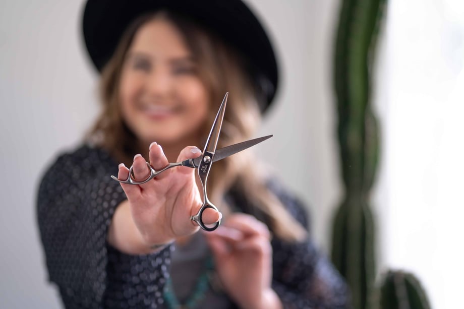 Stylist holding scissors