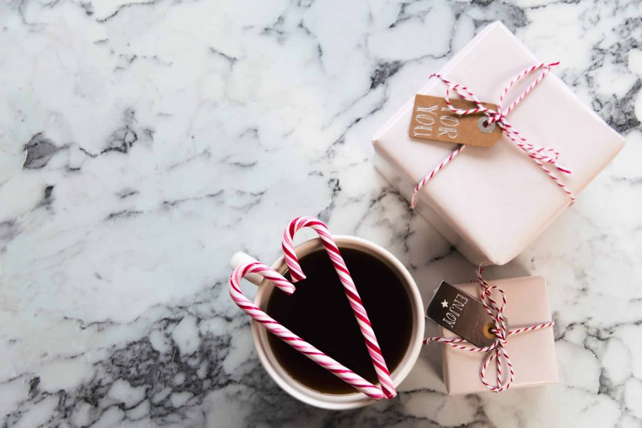 Coffee with candy canes and presents