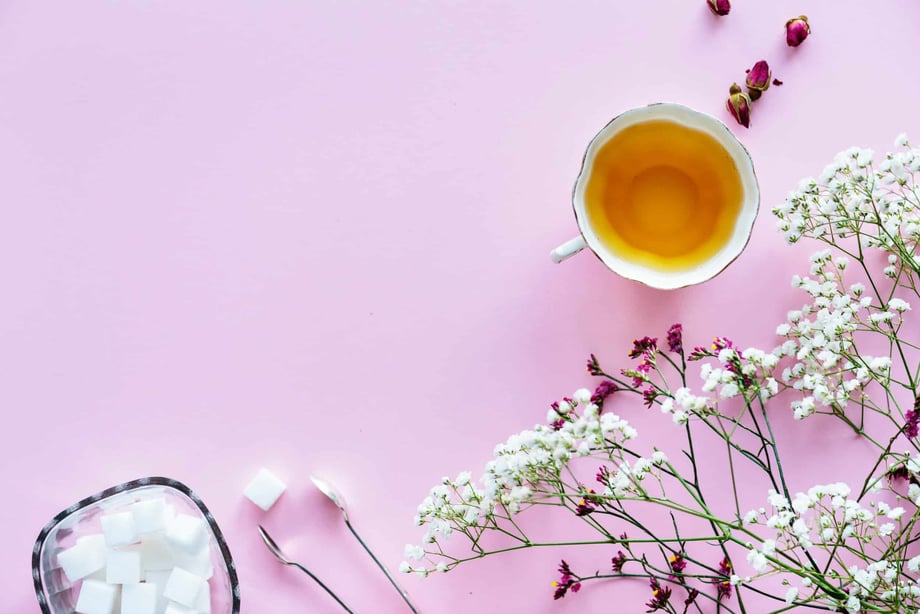 Tea, sugar cubes, and flowers