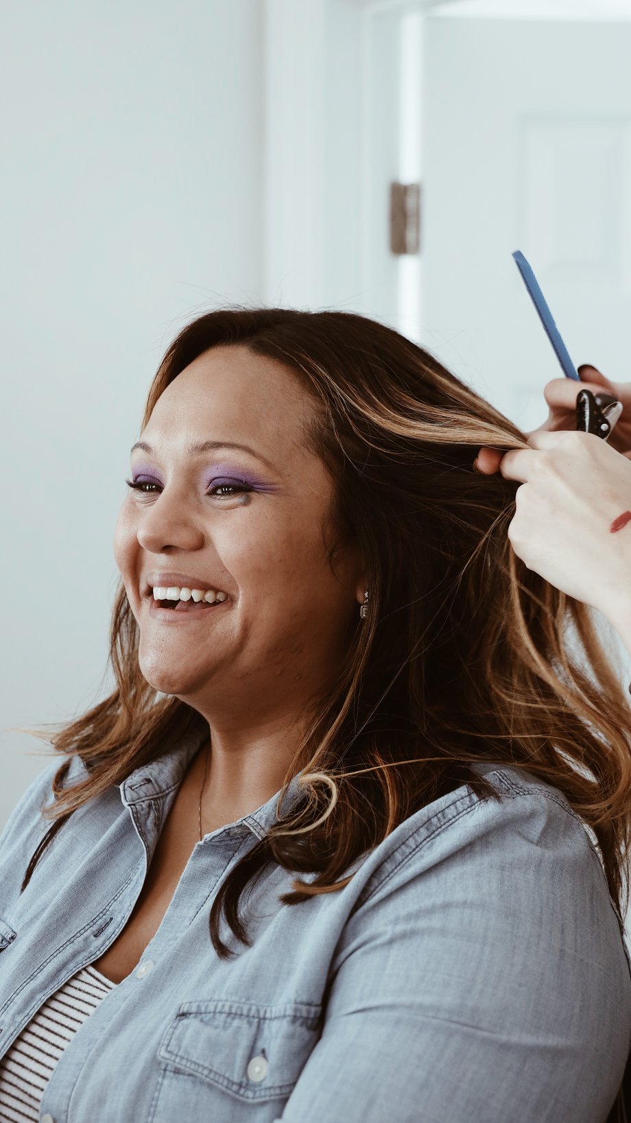 Stylist doing client's hair