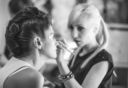 Stylist doing client's makeup
