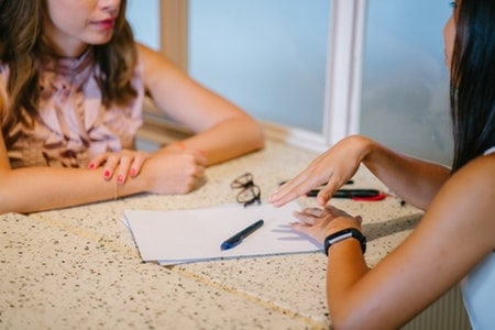 Salon owner interviewing stylist