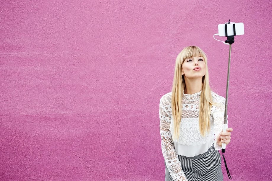 Woman holding selfie stick