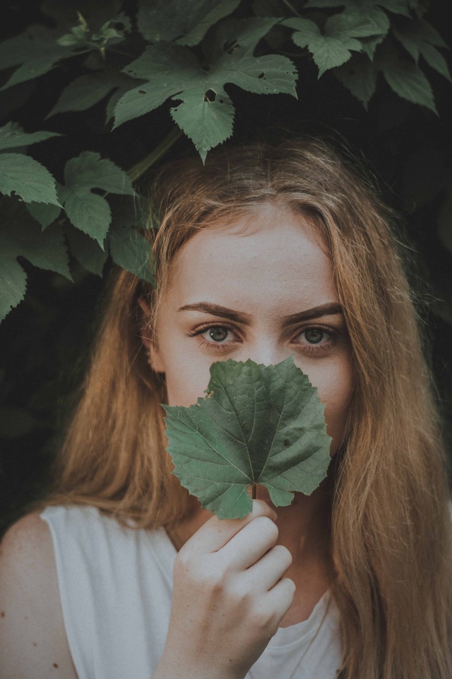 Woman holding leaf