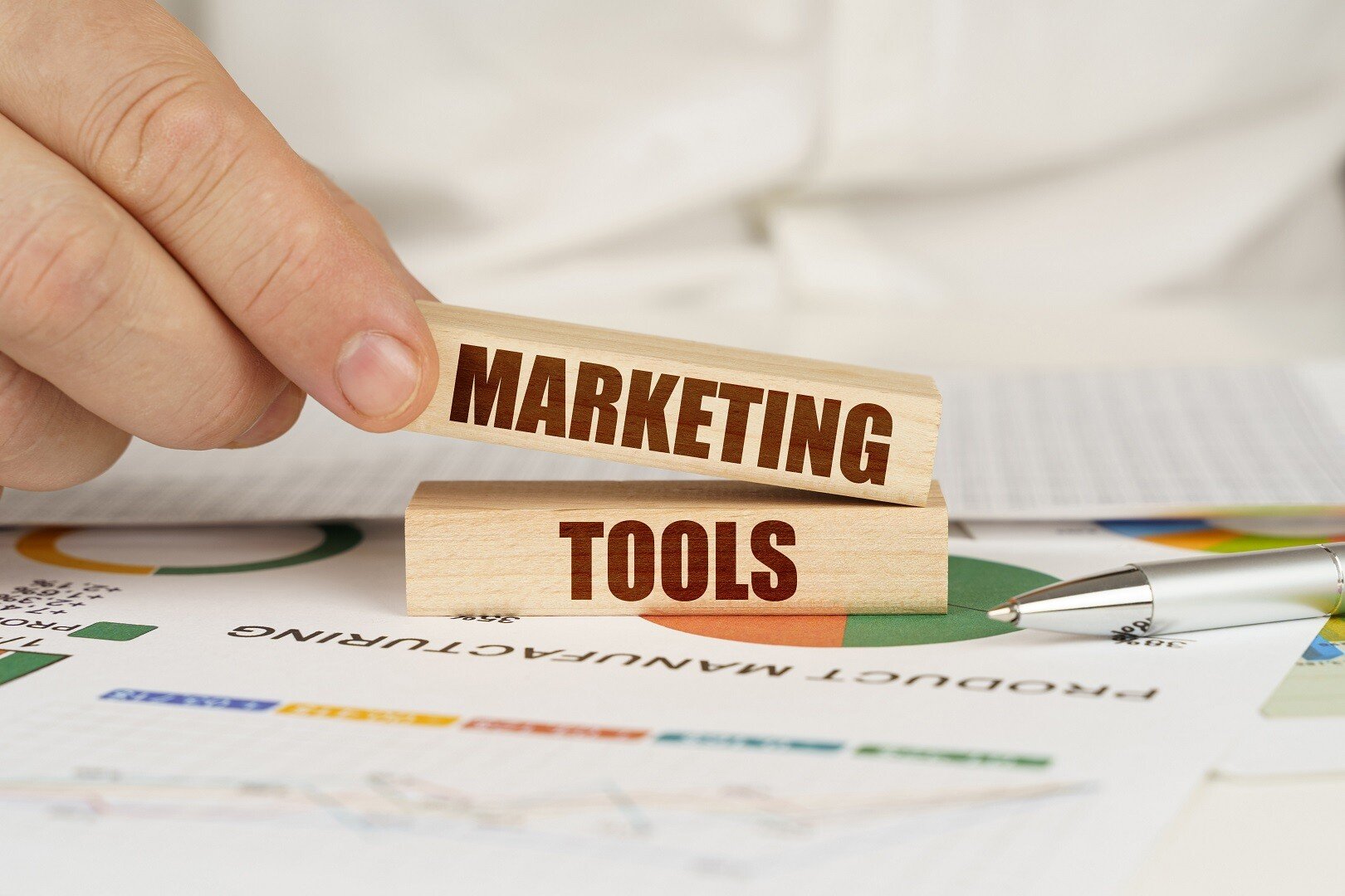 Marketing and tools represented by blocks with words, symbolizing essential marketing tools for business growth