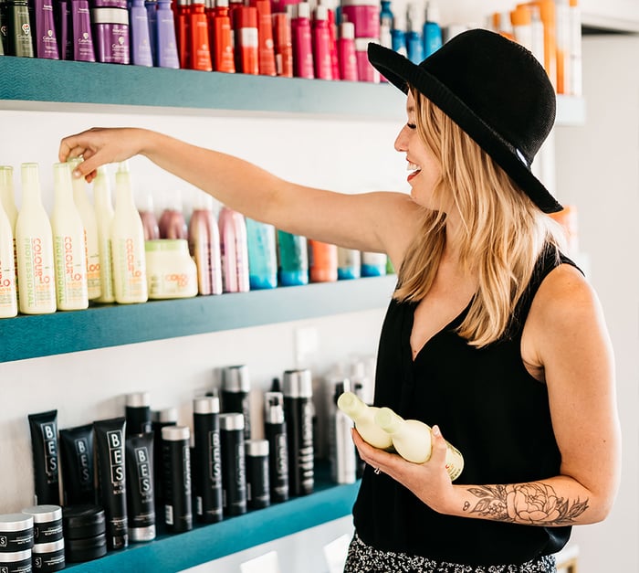 Stylist grabbing hair products